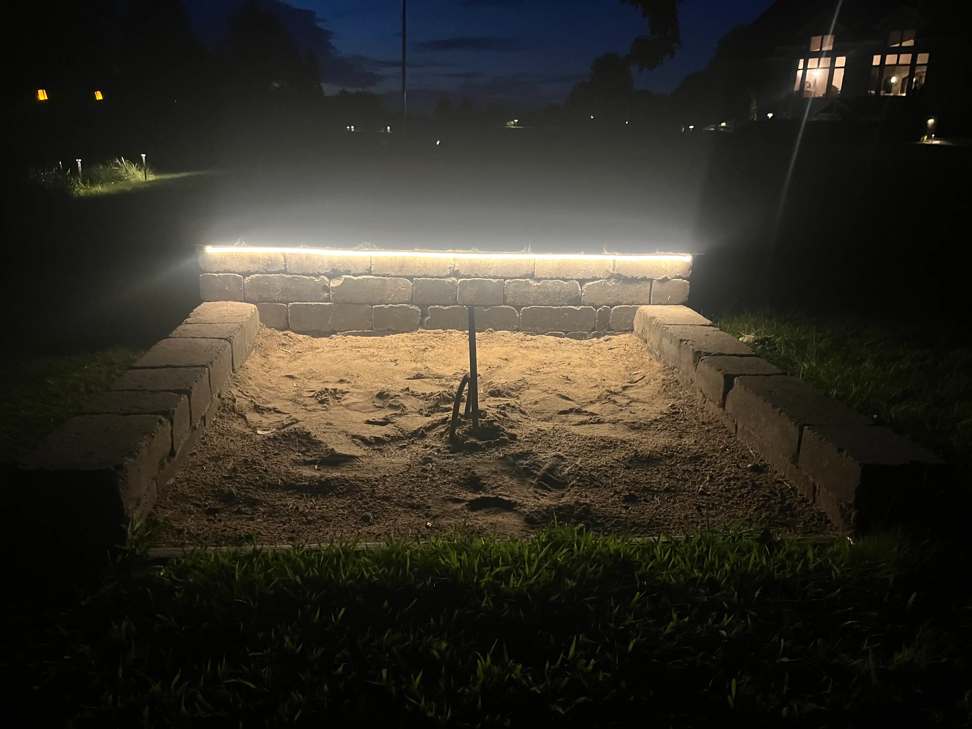 Landscape lighting system highlighting trees and landscape features